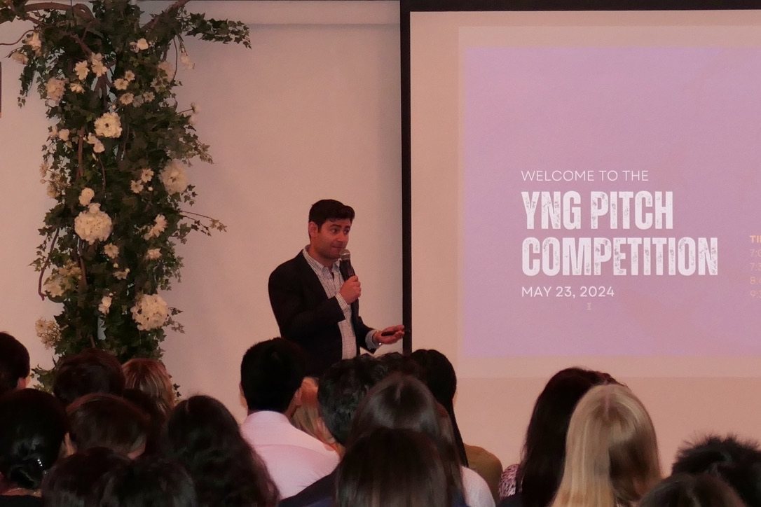 Alec speaking to a full room at the YNG Pitch Competition