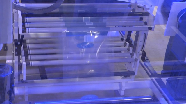 SV353 Single Roll Wrapper, Upstacker, Sweeper and Shrink Tunnel - Wrapping Cartons of Corn Bread Mix in a Print Registered Bulls Eye (45612)