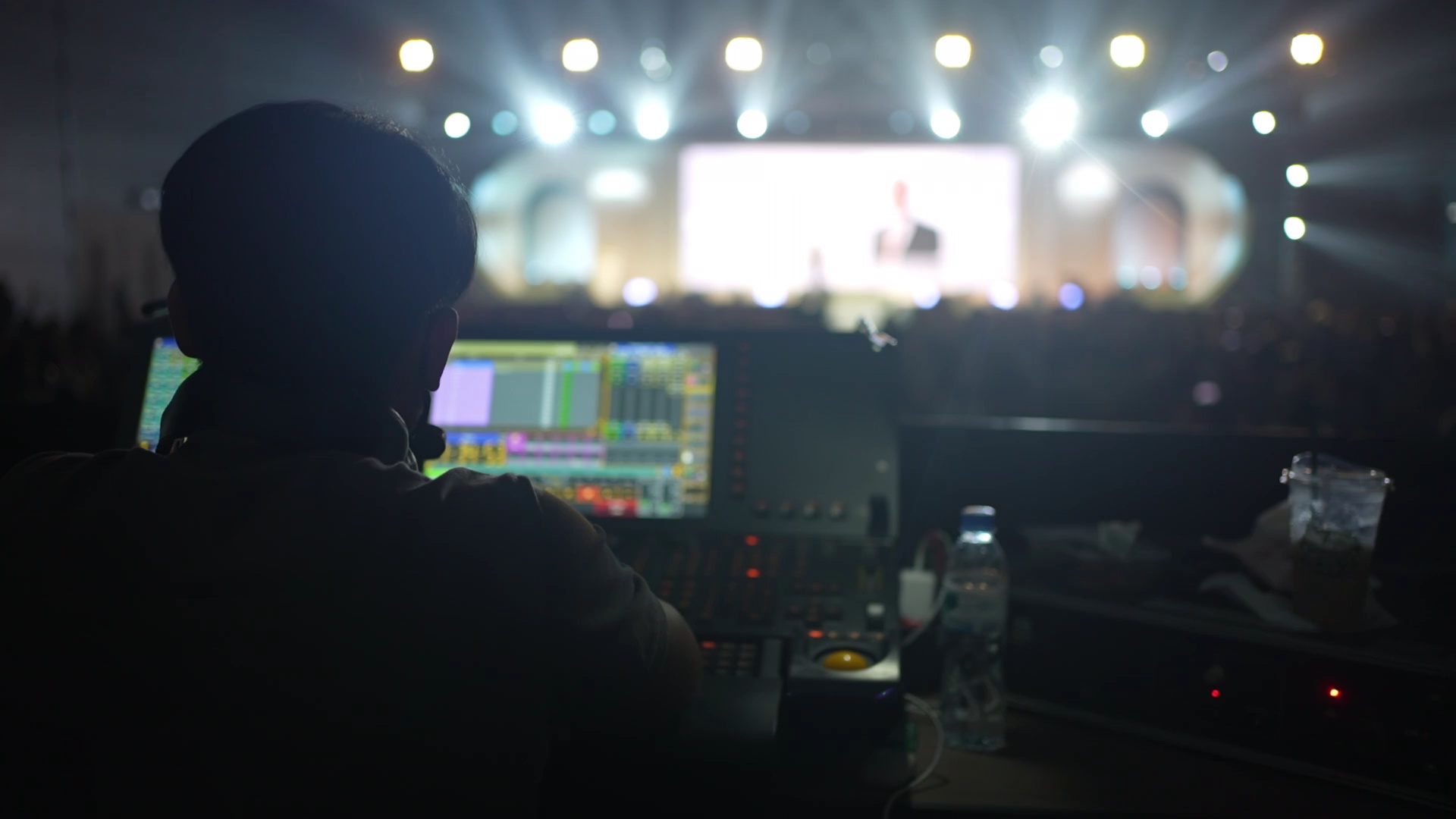 Front of house technician running lighting and show control at a live corporate event