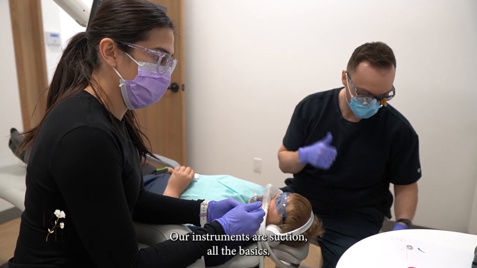 Dr. Darren Isfeld treating a young patient at Rivers Edge