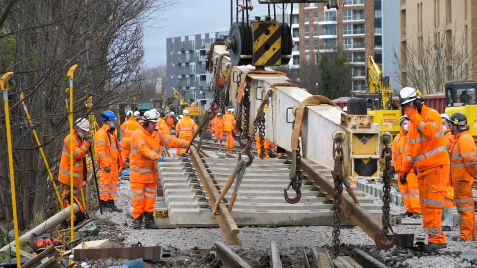 B ROLL DOWNLOAD Stockshots of plain line track renewal using rail mounted crane