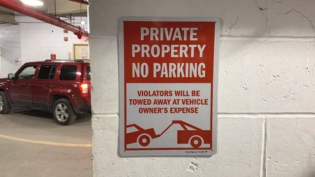 No Parking Violators Sign