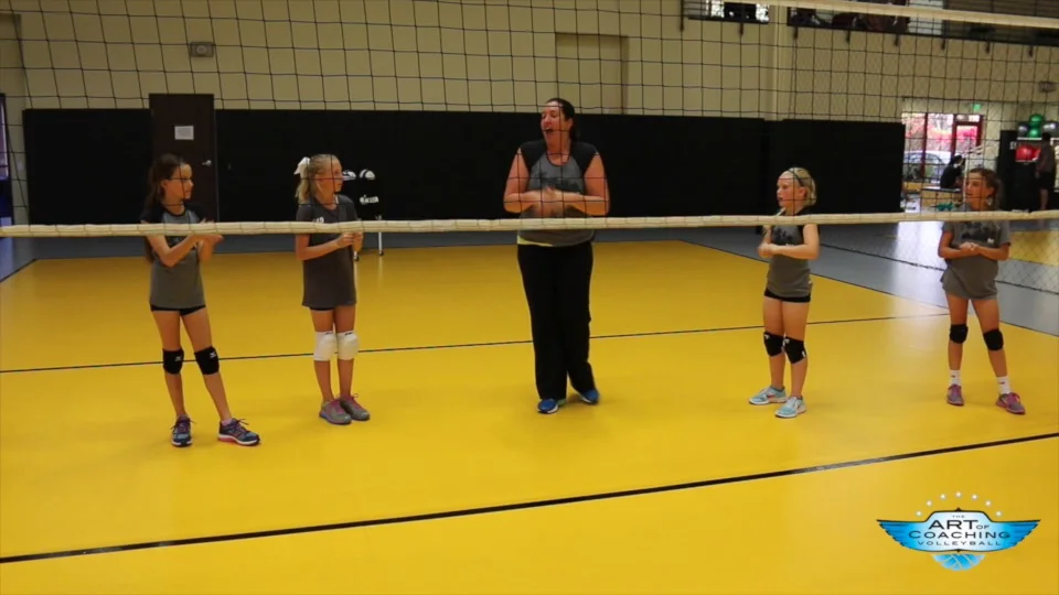 volleyball players hitting