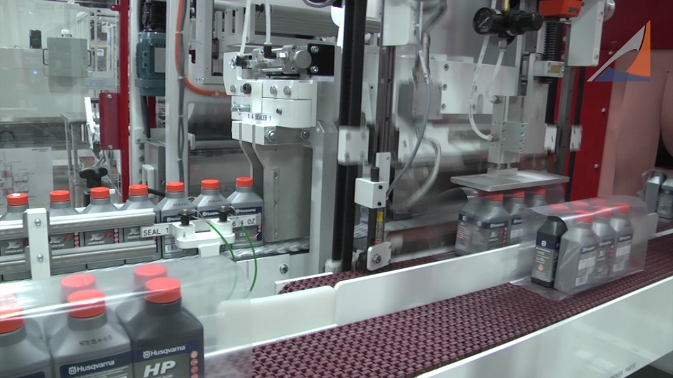 SV371 Twin Stream Side Feed Automatic Turning Screw and Shrink Tunnel - Wrapping Bottles of Oil (45690)