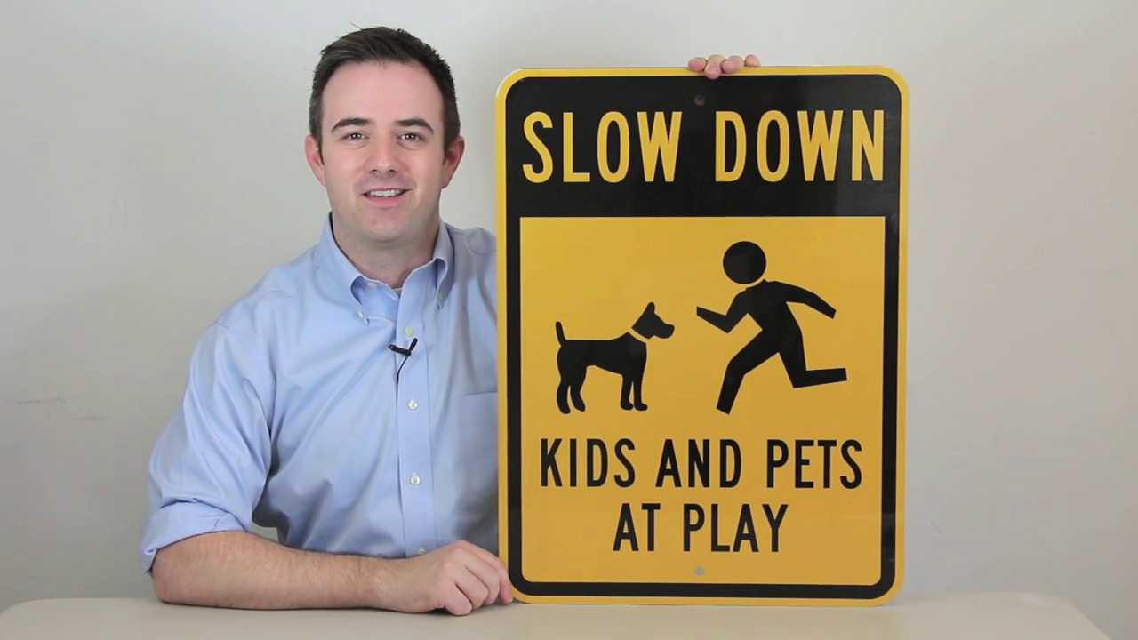 Slow Down Kids And Pets At Play Sign