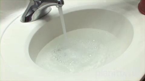 bathroom sink filling up with water