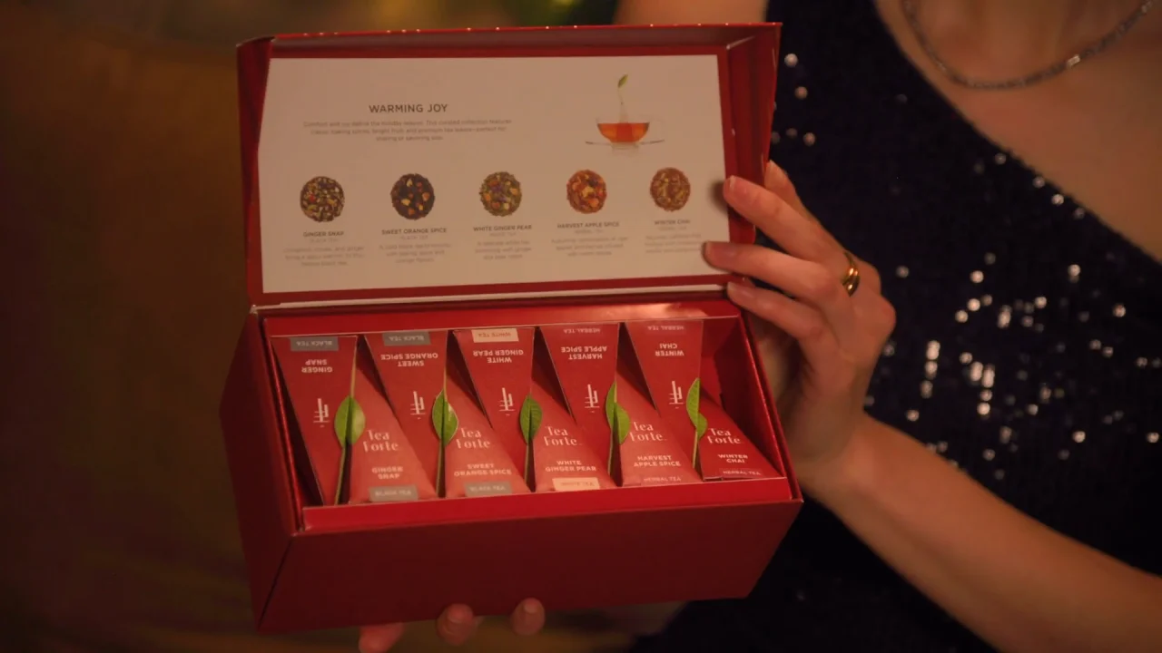 Warming JOy Video showing a variety of package types and women enjoying dinner and tea together during the holidays.