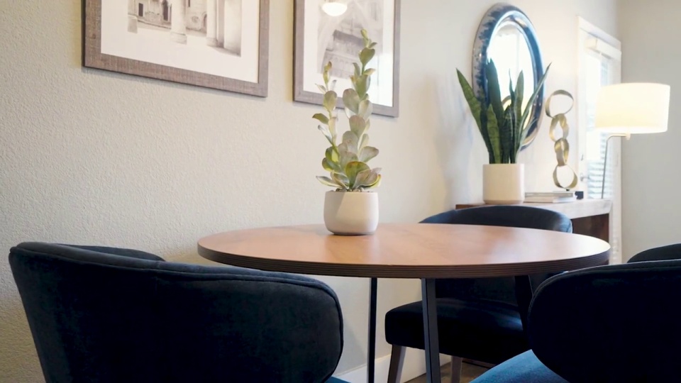 Furnished dining area shown at Oxford Apartments.