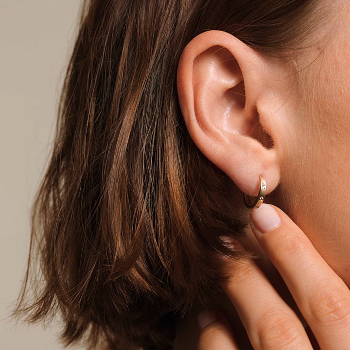 14K Yellow Gold Cielo Flush Set Diamond Huggie Earrings (1/8 ct. tw.)