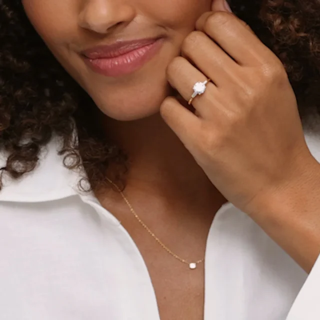 18K Yellow Gold Adorned Tapered Baguette Three Stone Diamond Ring