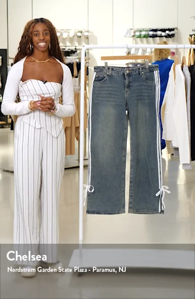 EDIKTED Mattie Side Stripe Bow Low Rise Wide Leg Jeans