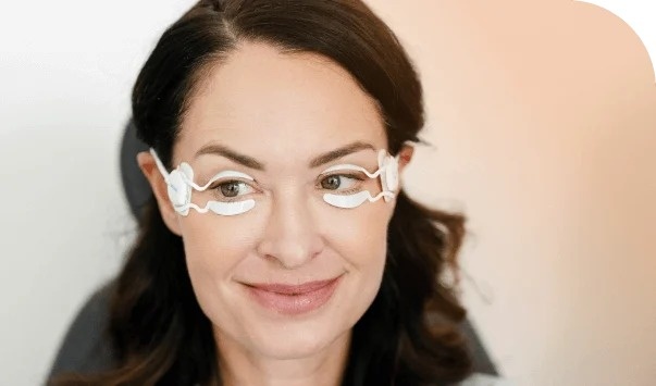 Patient wearing TearCare SmartLids with eyes open