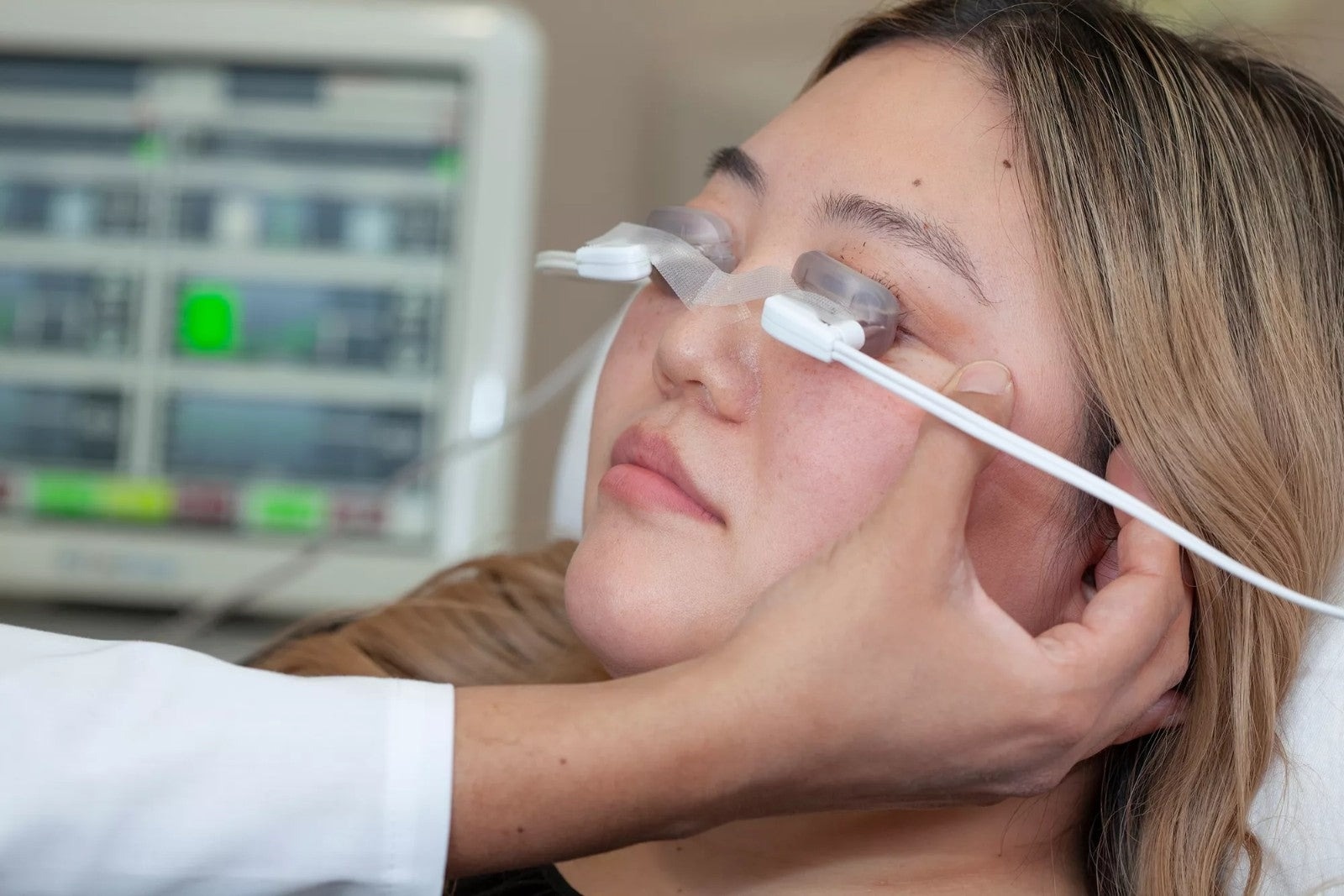 Patient receiving a LipiFlow treatment with Activators on both eyes