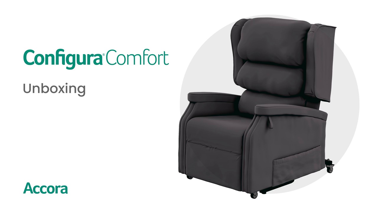 A dark, cushioned Accora Configura® Advance Postural Tilt Chair with wheels is shown beside the text "Configura Comfort Unboxing" and the brand name Accora, with a play button in the center to indicate a video.