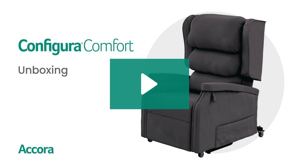 A dark, cushioned Accora Configura® Advance Postural Tilt Chair with wheels is shown beside the text "Configura Comfort Unboxing" and the brand name Accora, with a play button in the center to indicate a video.