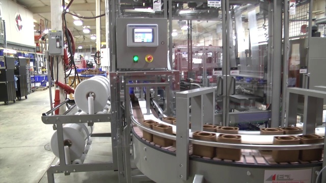 SV248 Triple Stream Side Feed Automatic 32-8, with inverting pick arm and shrink tunnel 32-12-45 - wrapping tottles of sunscreen