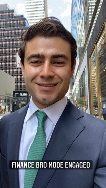 Alec in a suit on a New York street, with the caption finance bro mode engaged